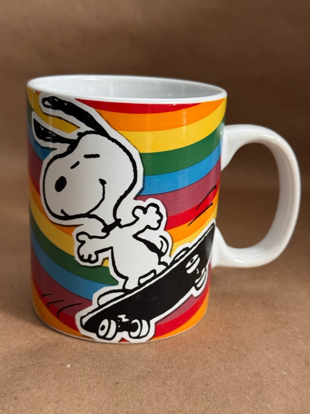 Peanuts 70th Anniversary Snoopy Rainbow Skateboarding Mug. 15 fl oz.